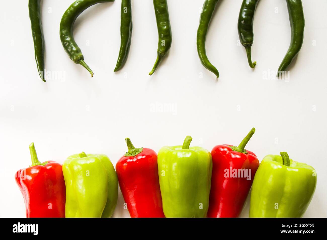 Top view of ripe green and red bell peppers and green chili peppers ...
