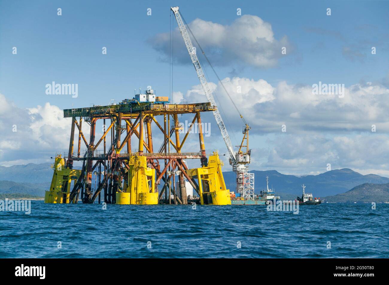 oil drilling rig under construction in a norwegian fjord Stock Photo