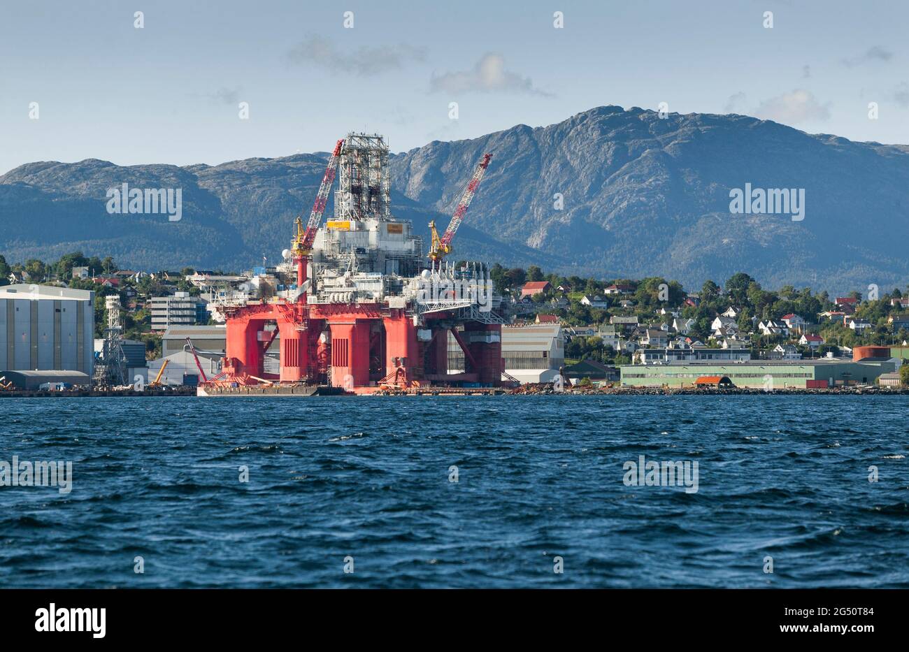 oil drilling rig under construction in a norwegian fjord Stock Photo