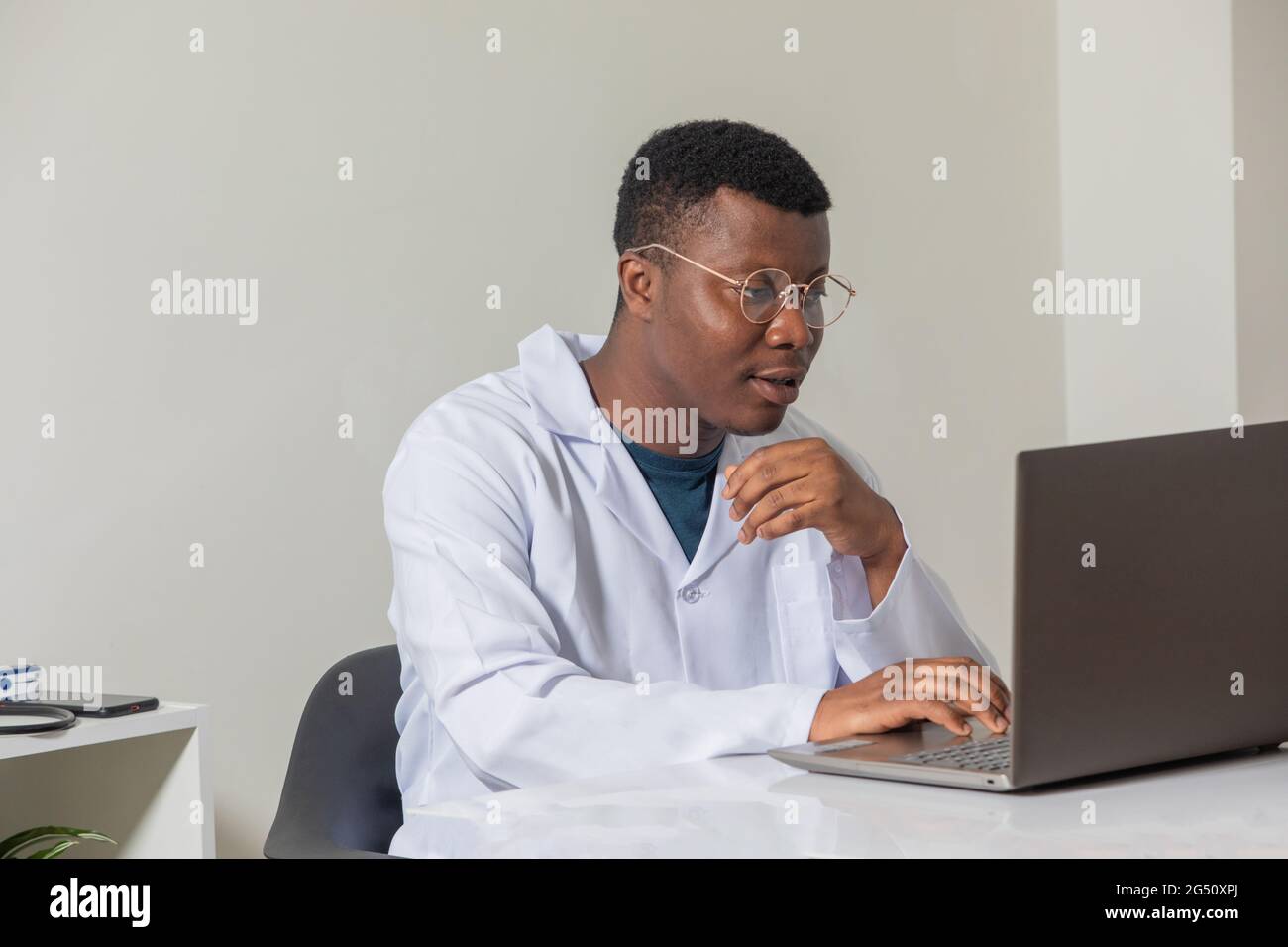 Portrait male black doctor using hi-res stock photography and images ...