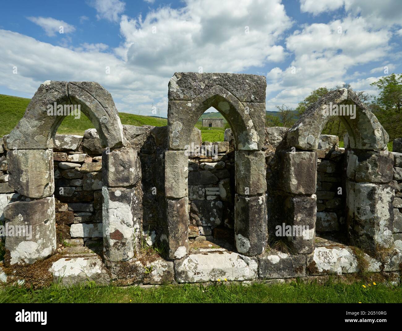 Three windows of the Chapel of Hermitage adjacent to Hermitage Castle in the Scottish Borders. Stock Photo
