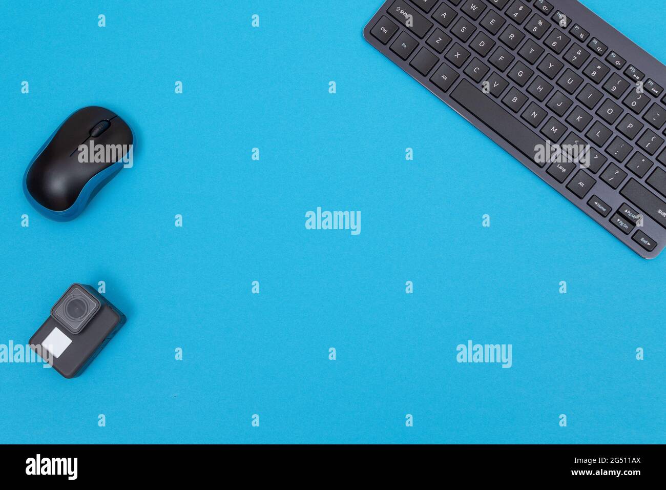 Office Workplace with Digital Gadgets Lying on Blue Table - Flat Lay Stock Photo