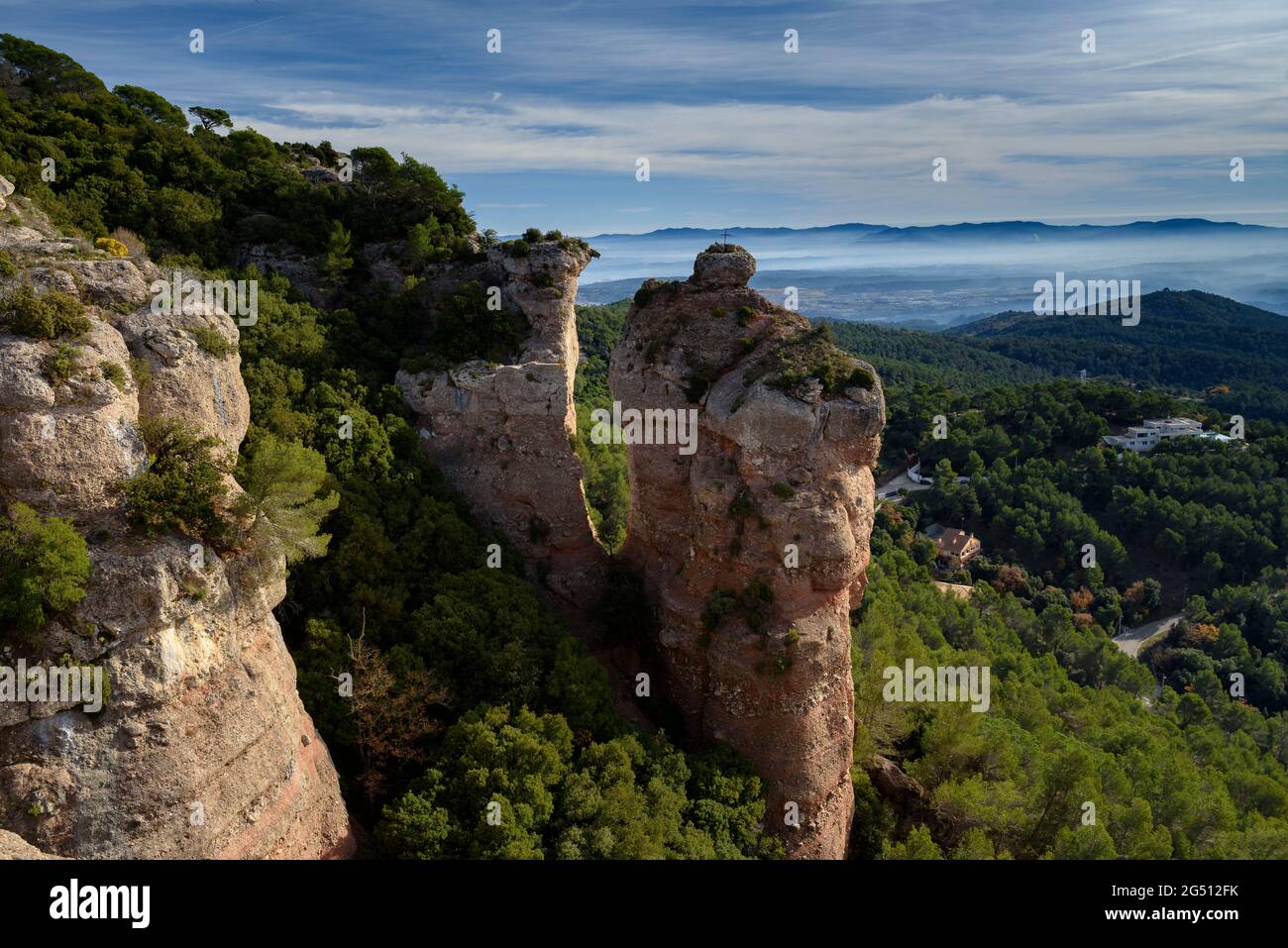 Esquirol rock, in the cliffs of La Mola southern face (Vallès Occidental, Barcelona, Catalonia, Spain) ESP: La roca del Esquirol en la Mola (Cataluña) Stock Photo
