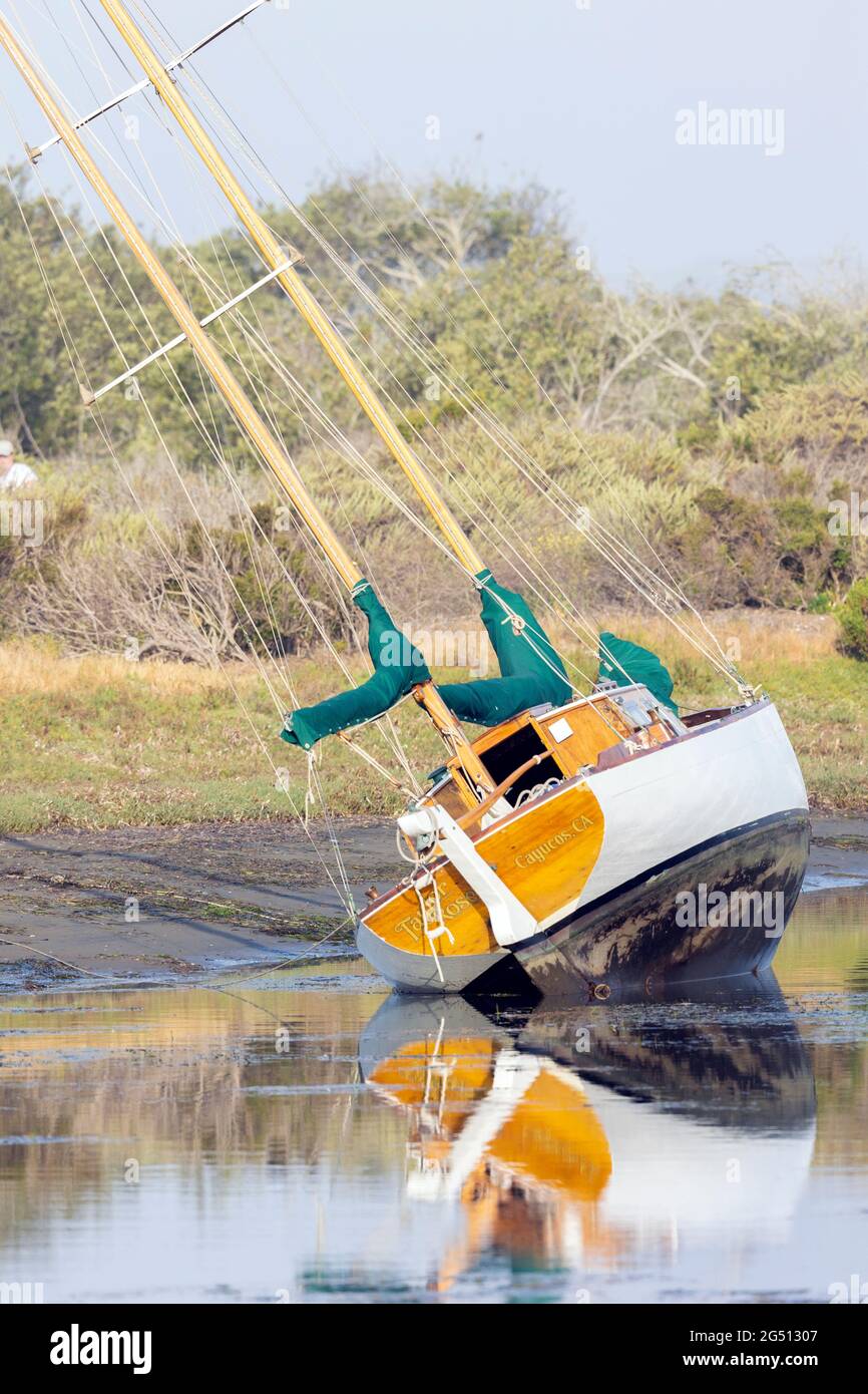 Sail Boat Beached at Low Tide Stock Photo