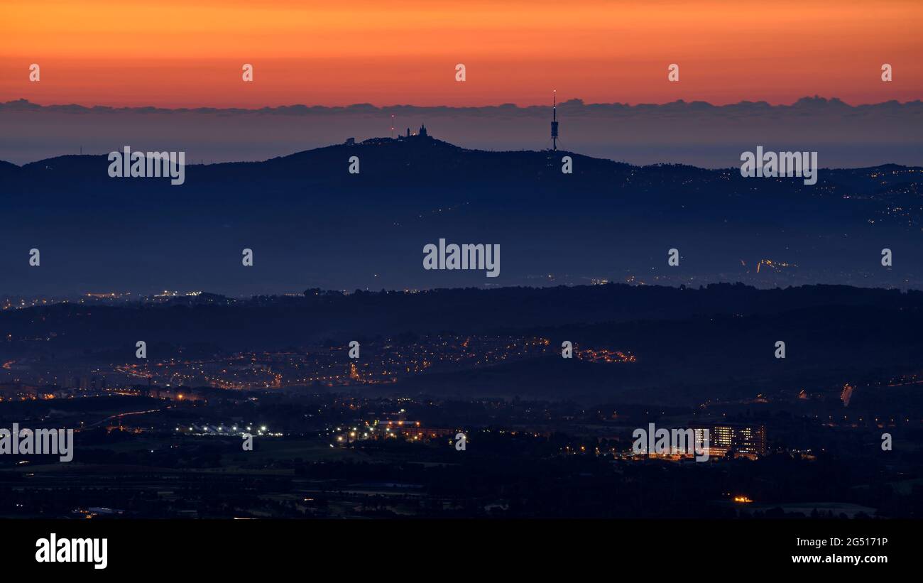 Sunrise over the Collserola mountain range seen from Matadepera, in Sant Llorenç del Munt i l'Obac (Vallès Occidental, Catalonia, Spain) Stock Photo