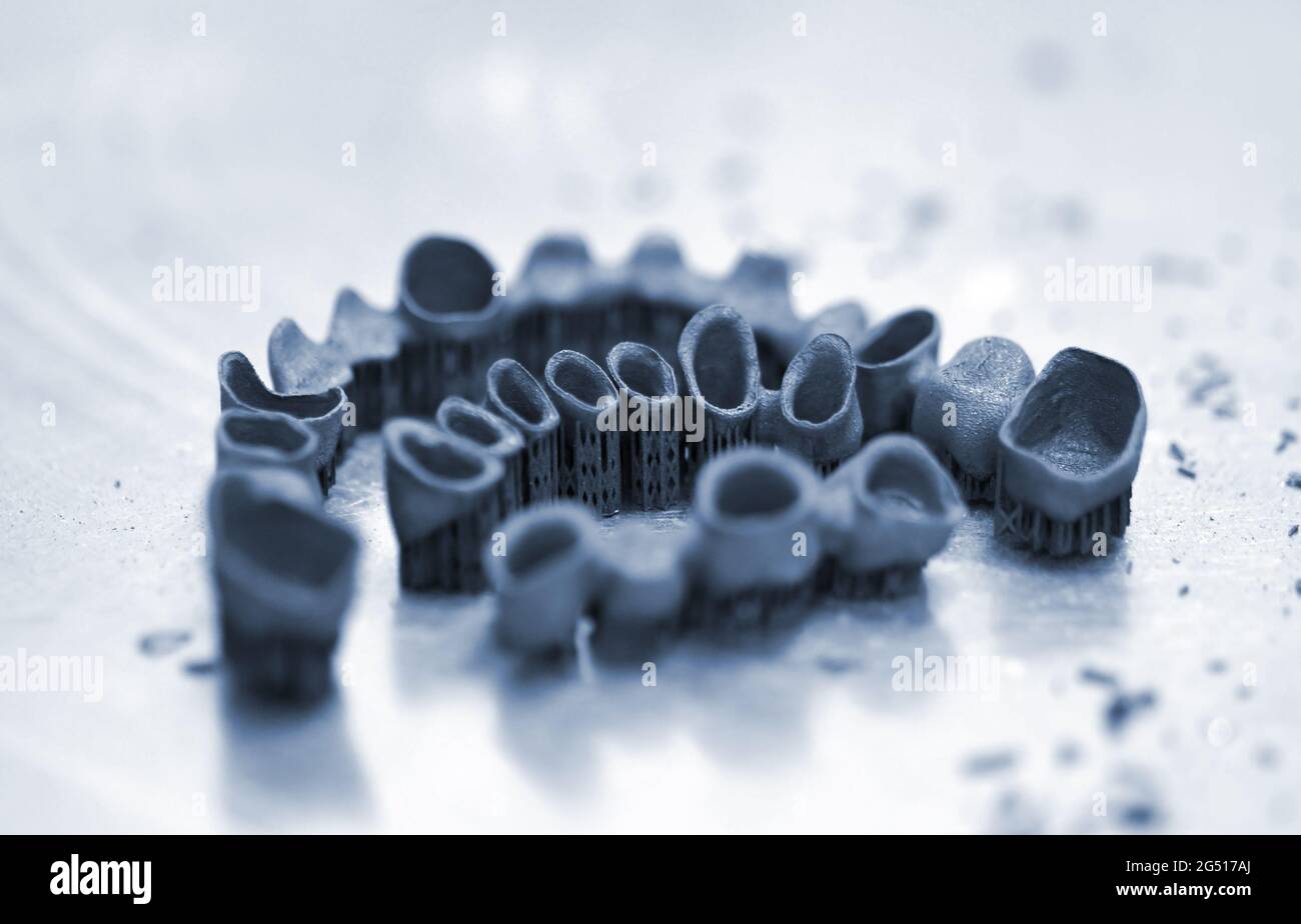 Tooth dental crowns created on 3d printer for metal Stock Photo