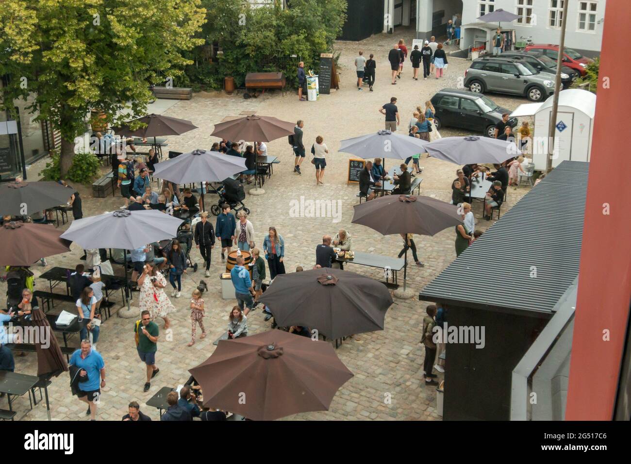 Ebeltoft, Denmark - 20 July 2020: The old malt factory converted into a culture house, people around the culture house in Ebeltoft Stock Photo