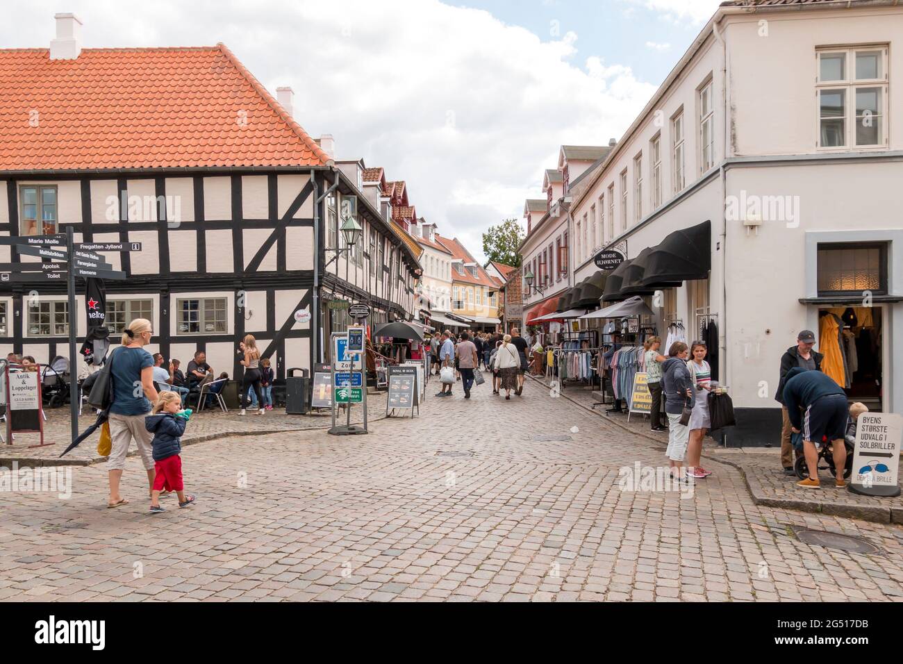 Ebeltoft, Denmark - 20 July 2020: Many people on the old pedestrian street, People are out shopping, shops along the pedestrian street Stock Photo