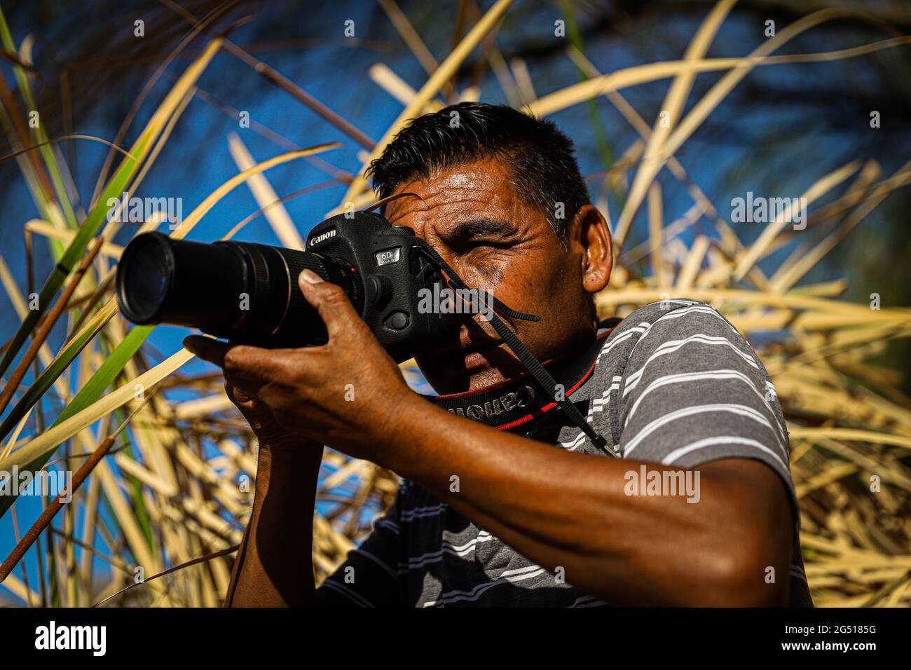 Portrait of the photojournalist Jorge Flores, during a visit to the La  Sauceda Wetland. Days before, he and his fellow photographers at the  Expreso newspaper were fired. This puts an end to