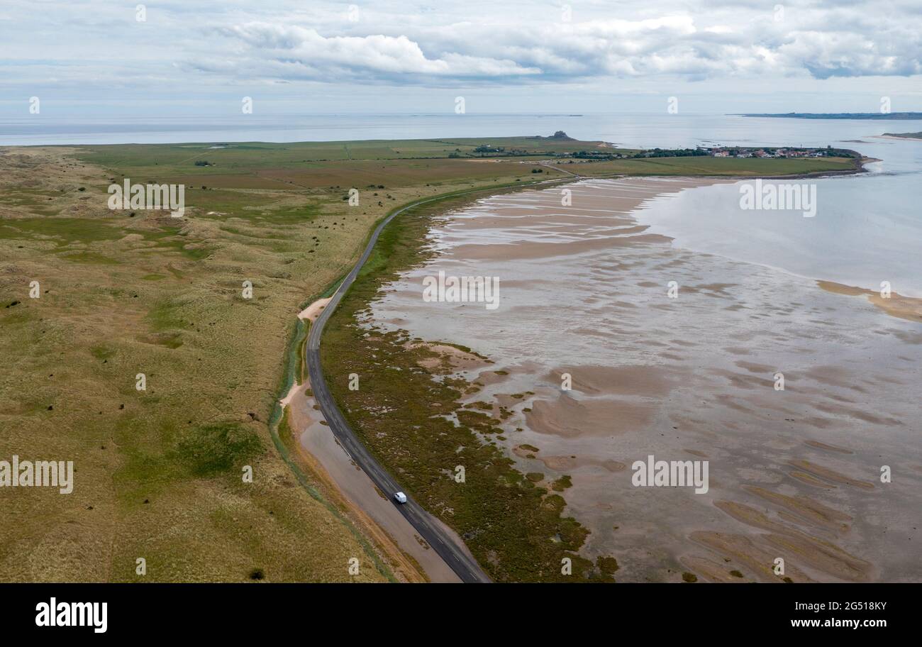 Aerial view of the road connecting Lindisfarne, (Holy Island) to the Northumberland mainland. The Causeway get covered by the sea at high tide Stock Photo