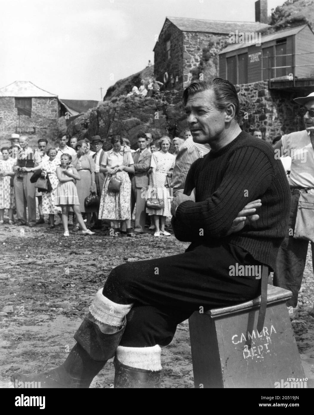 CLARK GABLE on set candid being gawped at by British Tourists during filming at Mullion Cove in Cornwall for NEVER LET ME GO 1953 director DELMER DAVES from novel Come The Dawn by Paul Winterton producer Clarence Brown Metro Goldwyn Mayer Stock Photo