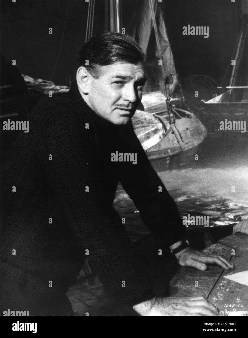 CLARK GABLE on set candid portrait during filming of NEVER LET ME GO 1953 director DELMER DAVES from novel Come The Dawn by Paul Winterton producer Clarence Brown Metro Goldwyn Mayer Stock Photo