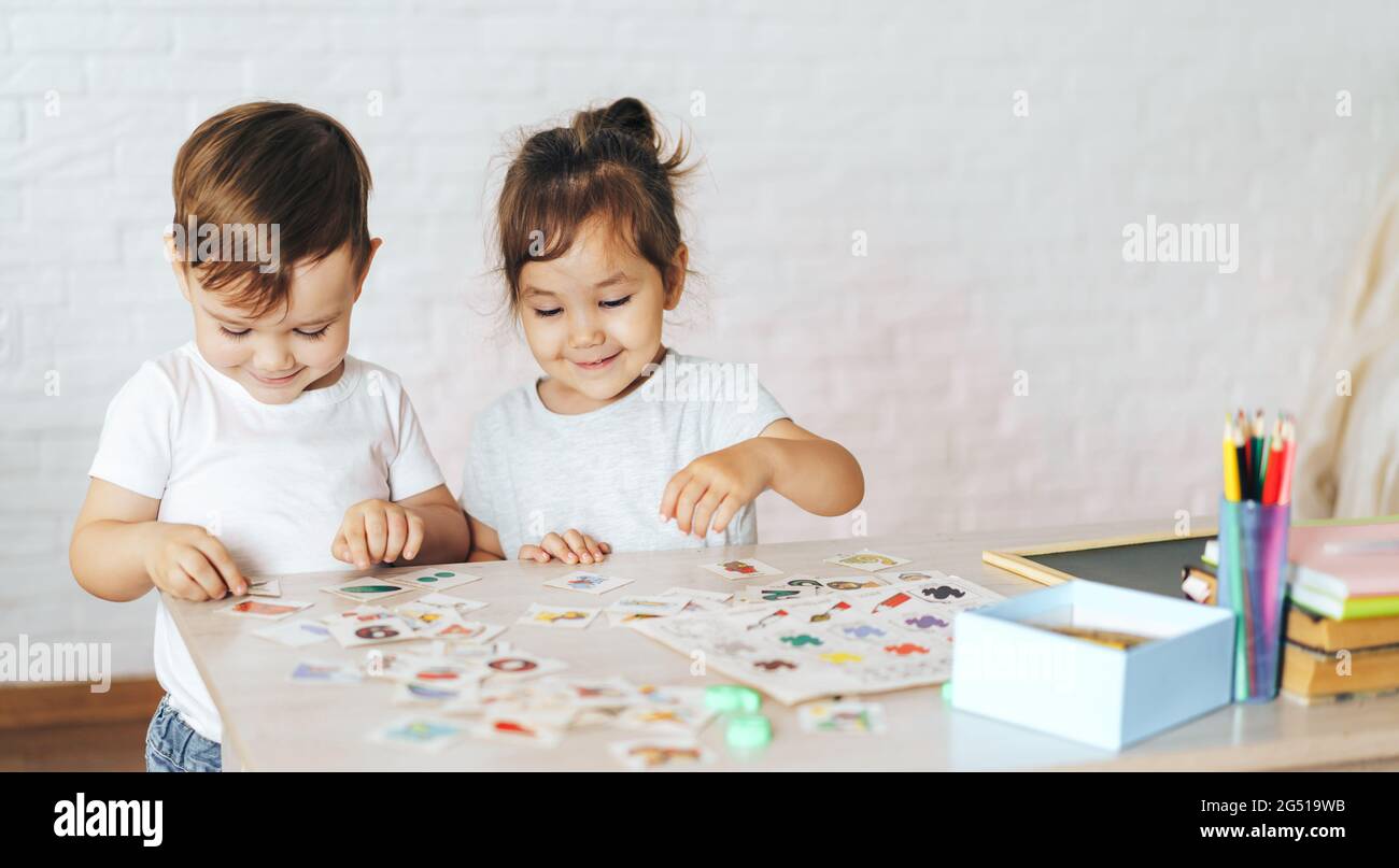 Children play educational games at the school desk Stock Photo Alamy