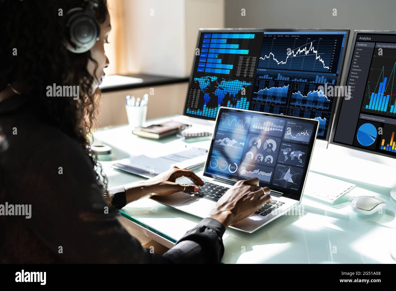African Advisor Using KPI Dashboard With Financial Analytics Graphs Stock Photo