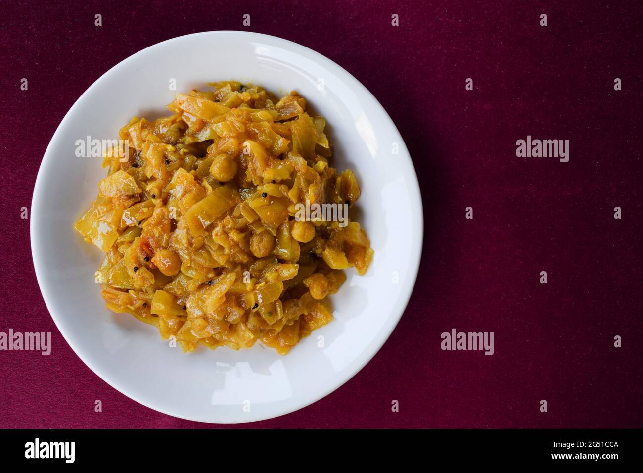 Tasty Cabbage curry stir fried with lentils pulses blackgram. Cabbage sabji top view south indian Stock Photo
