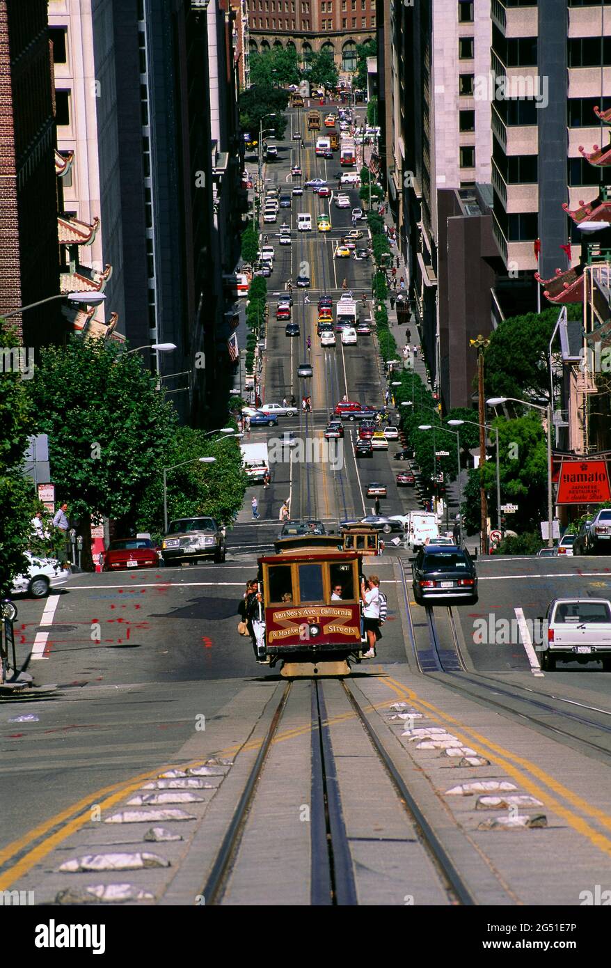 Cable car driving on steep street in San Francisco, California, USA Stock Photo