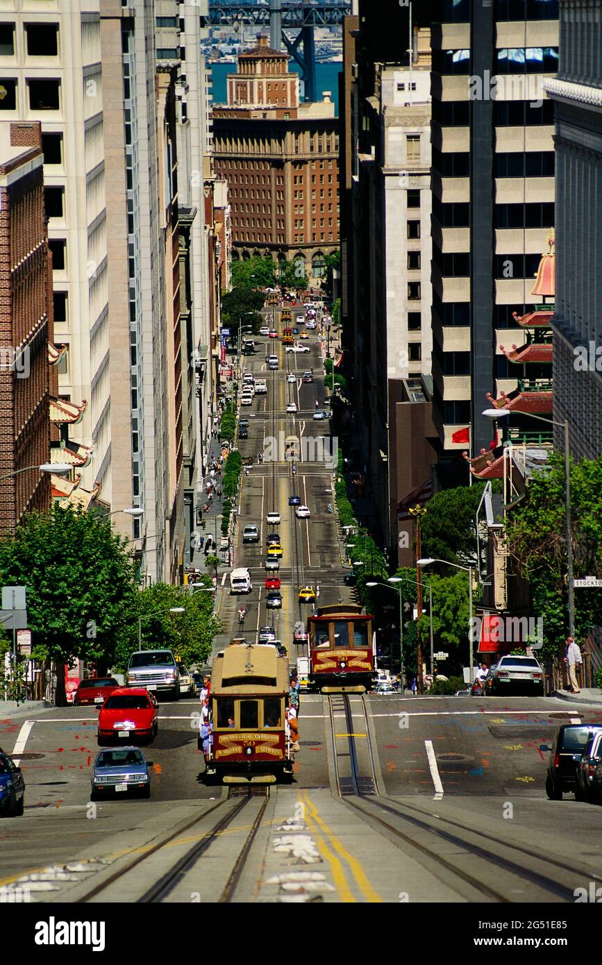 Cable car driving on steep street in San Francisco, California, USA Stock Photo