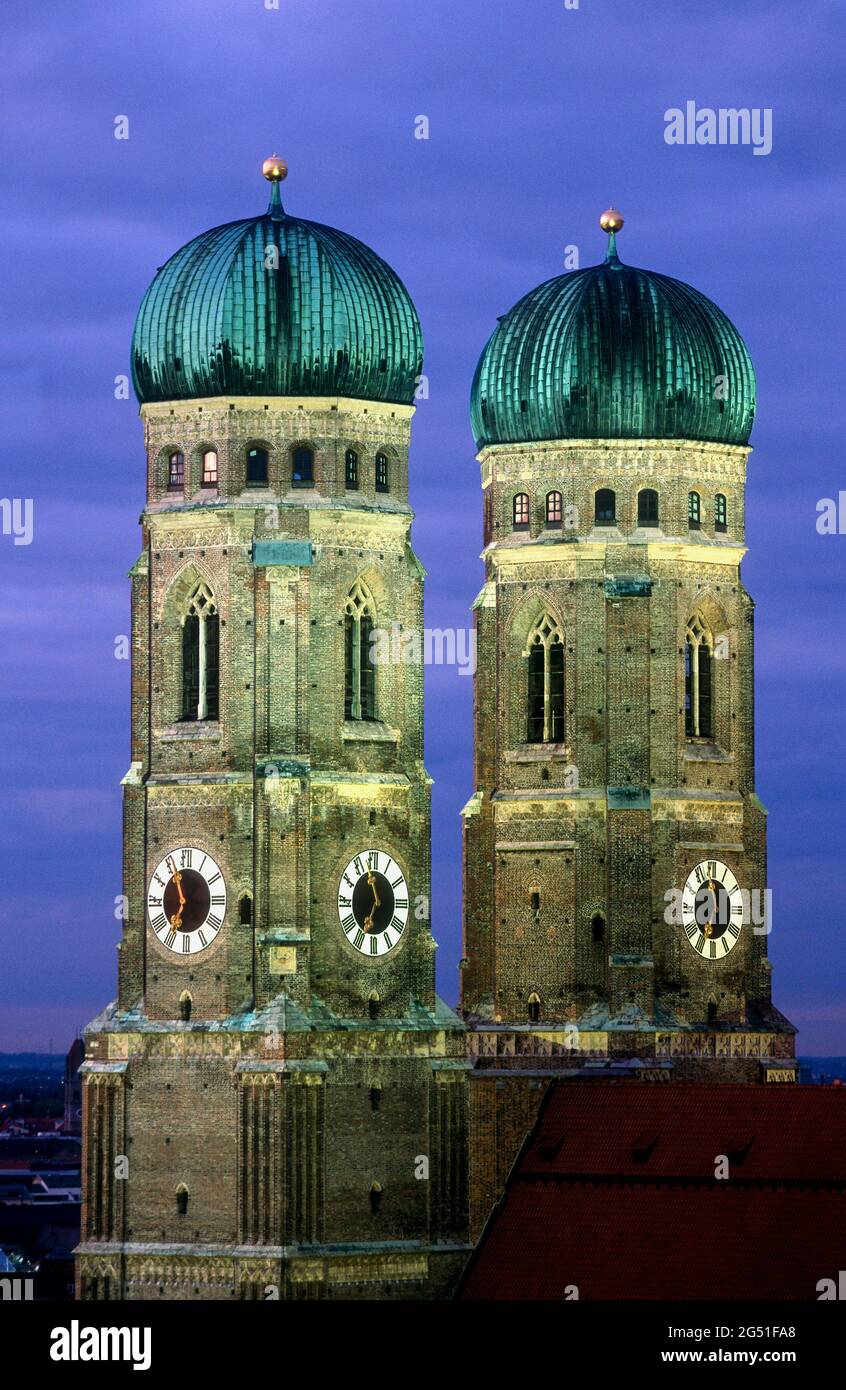 Clock towers at night, Frauenkirche, Munich, Bavaria, Germany Stock Photo