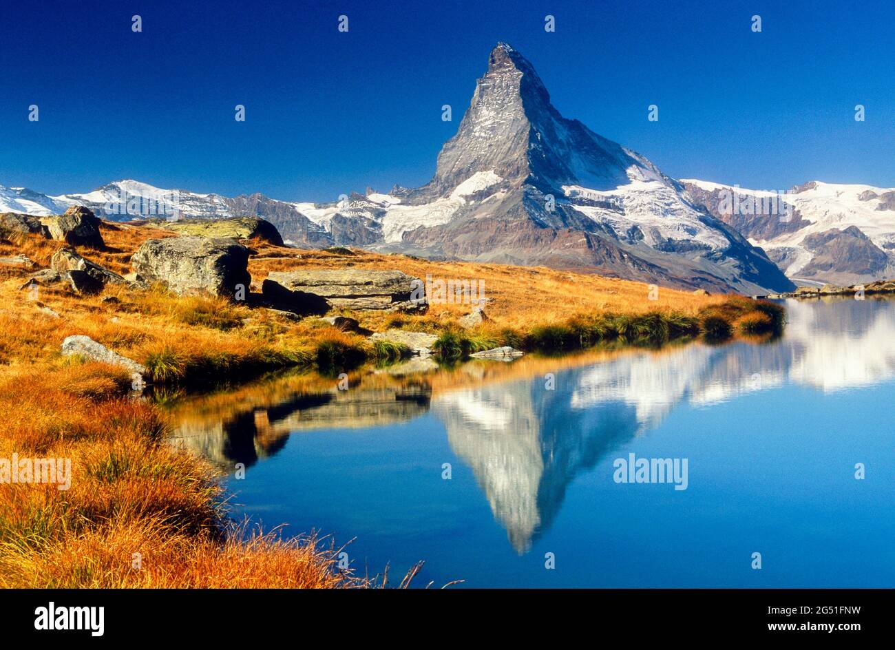 View of lake with mountain reflected in water, Matterhorn, Zermatt, Switzerland Stock Photo
