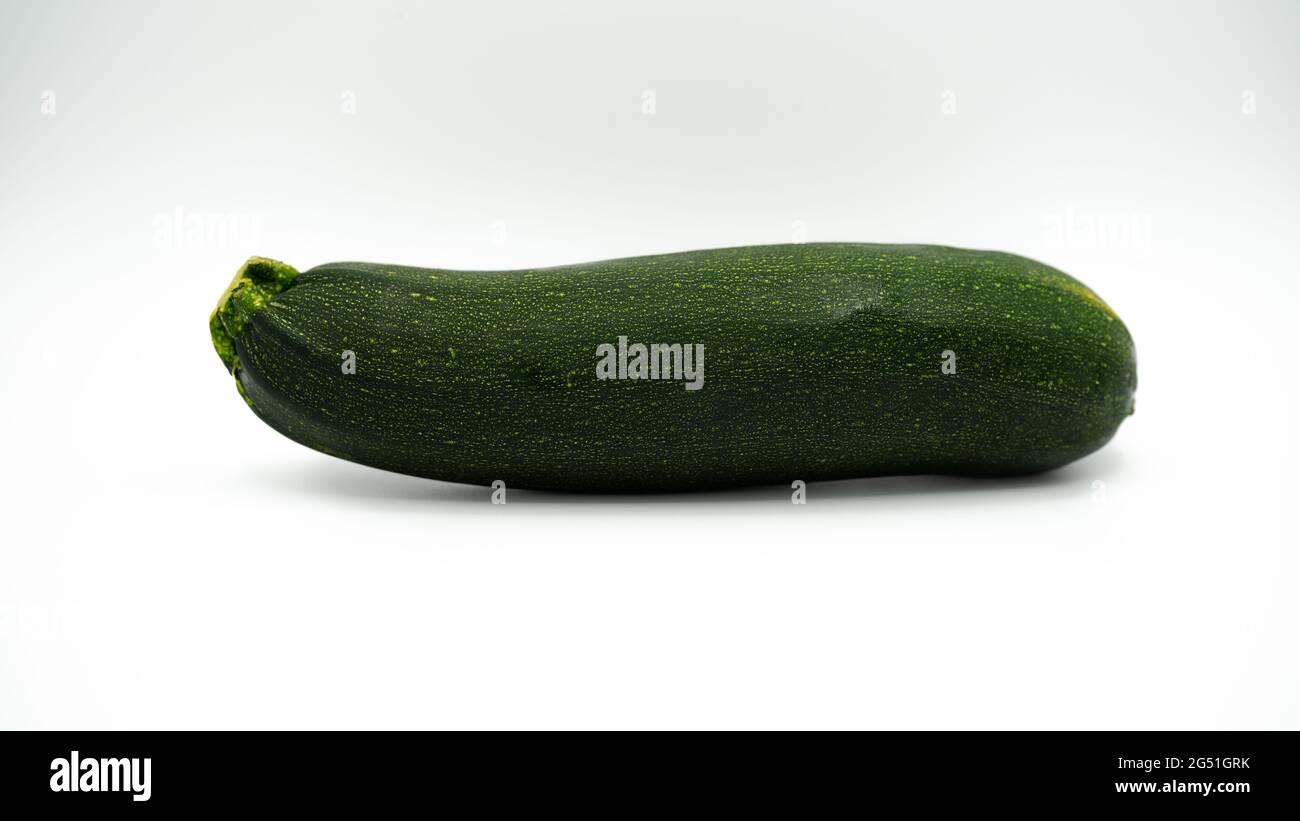 green zuccini on white background Stock Photo