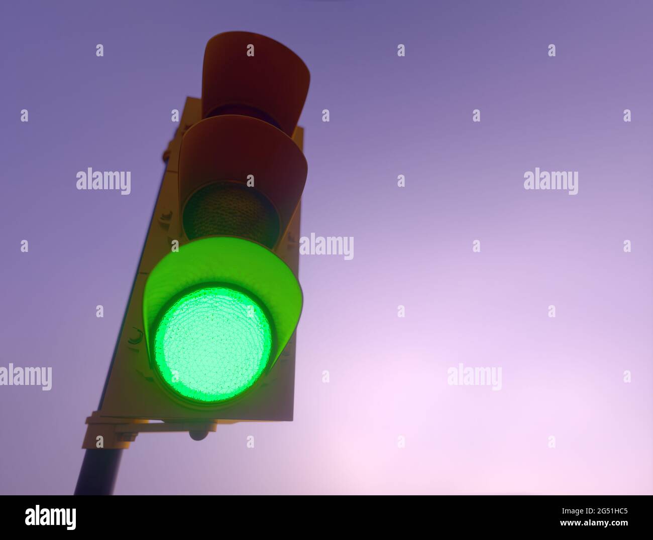 Outdoor vertical traffic light. Traffic control concept image with shallow depth of field. Stock Photo