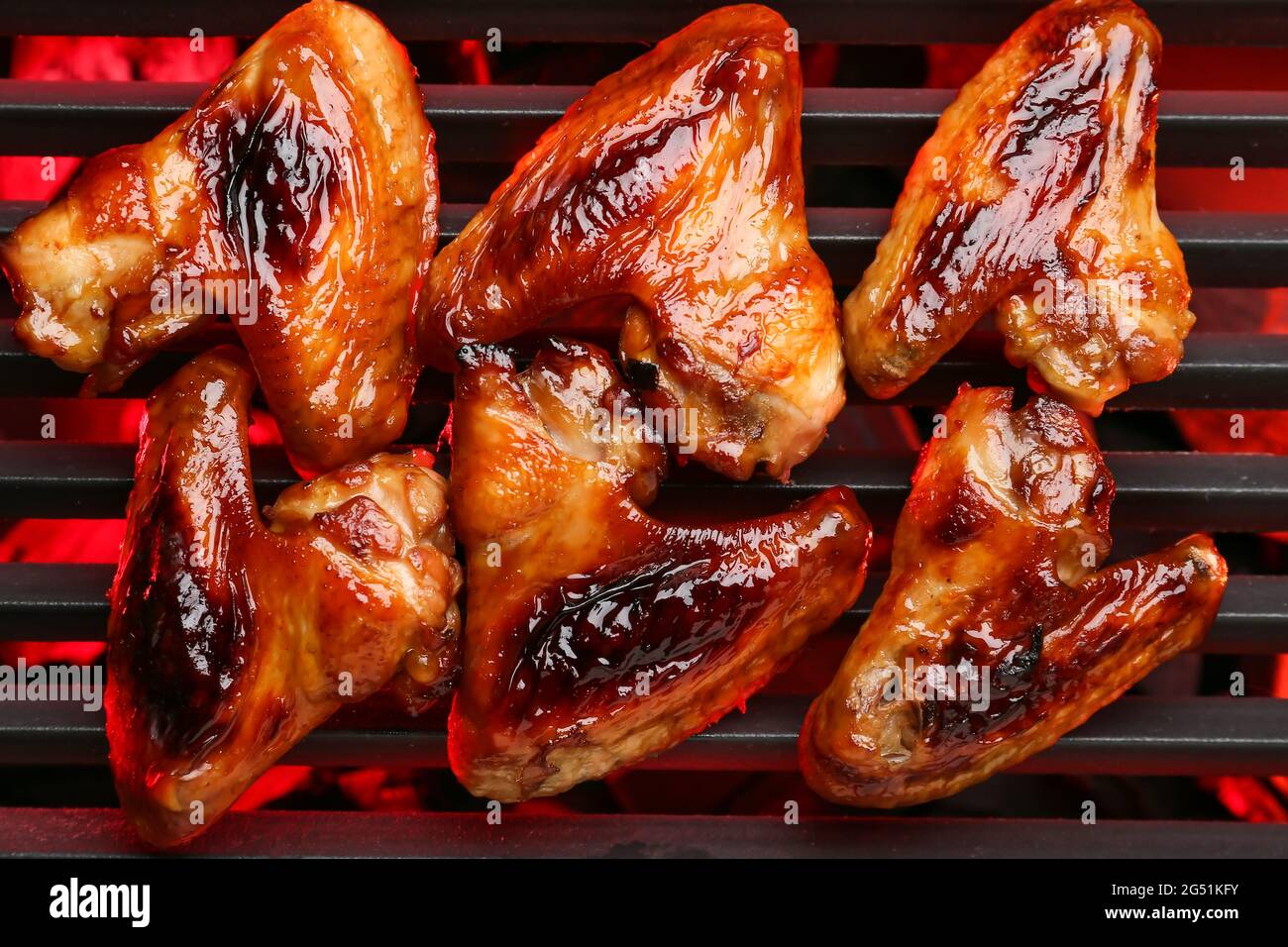 Roasted chicken wings cooking on grill Stock Photo Alamy