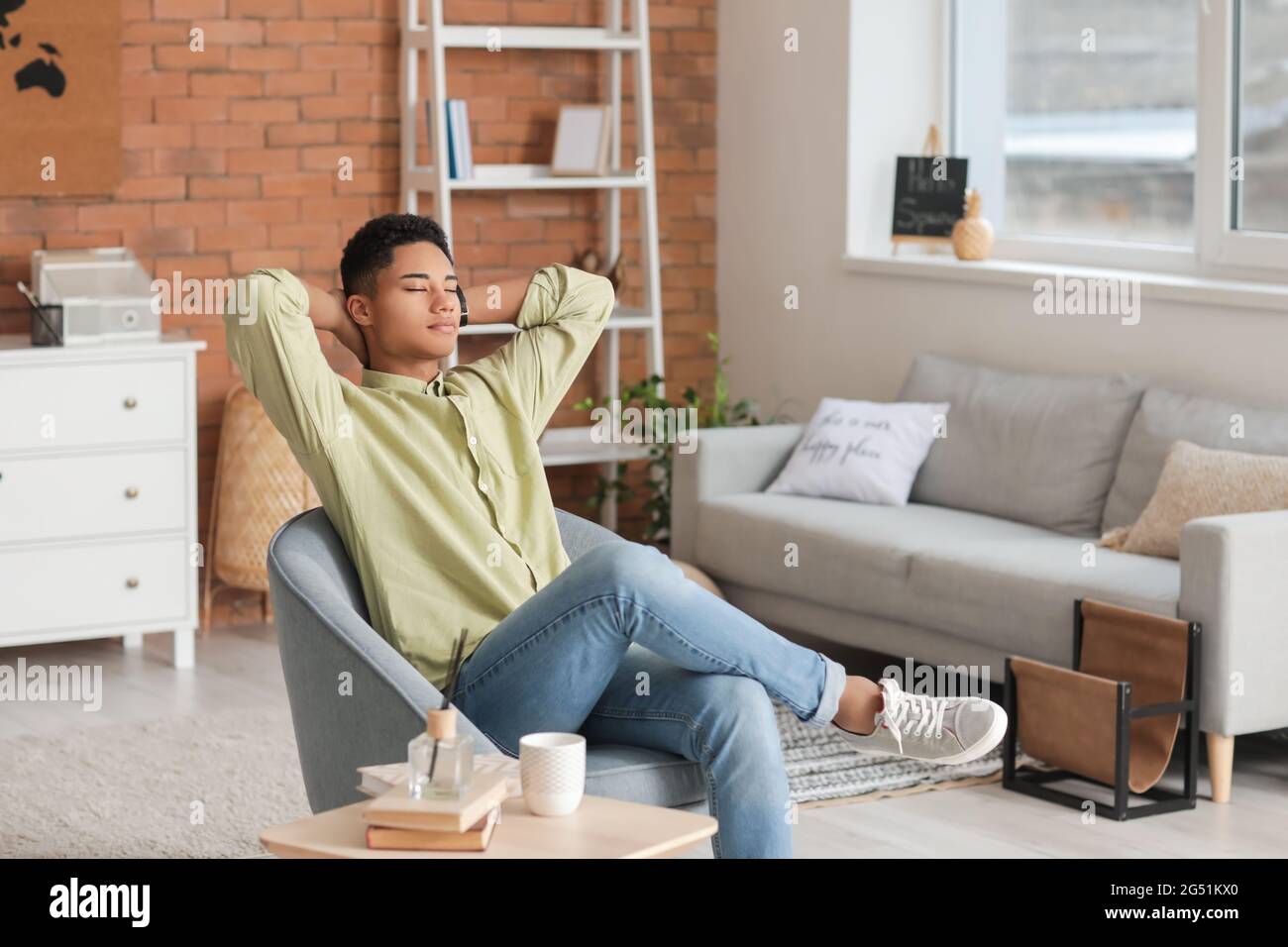 African american guy sitting in hi-res stock photography and images - Alamy