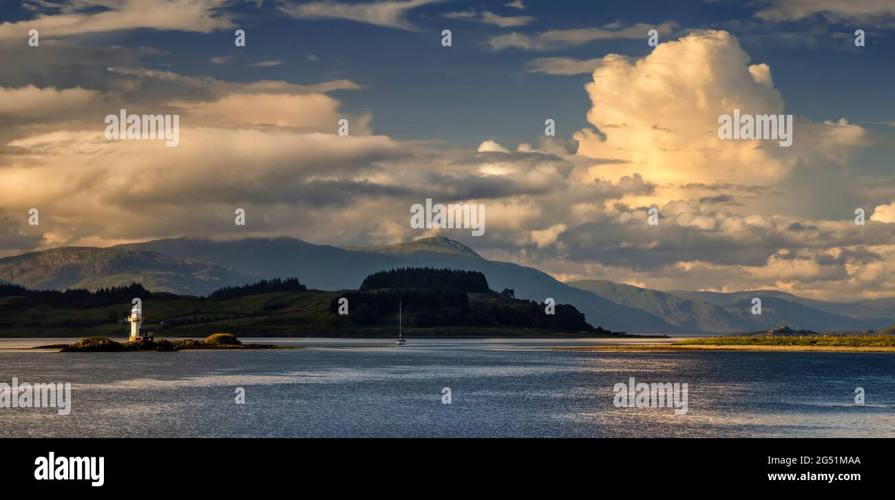 Lismore Island and lighthouse on Lynn of Lorn, Highlands, Scotland, UK Stock Photo