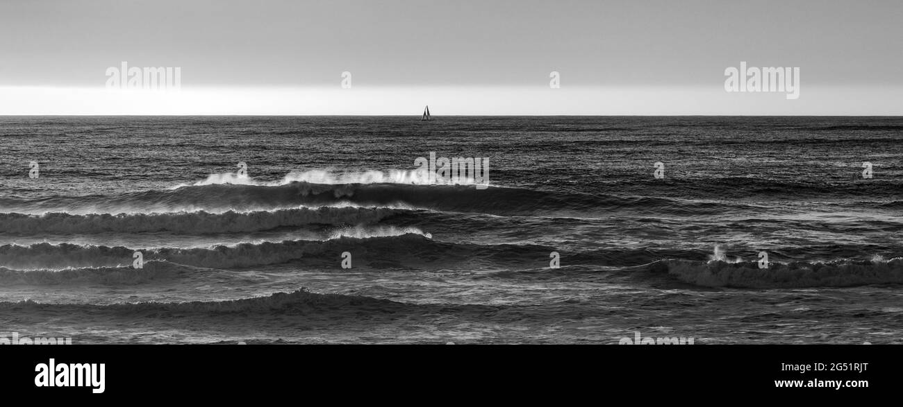 Crashing waves in Pacific Ocean in black and white Stock Photo