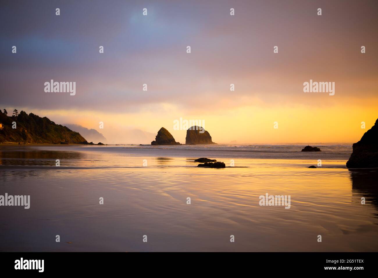 Beautiful colorful sunset at Cannon Beach, Oregon during low tide