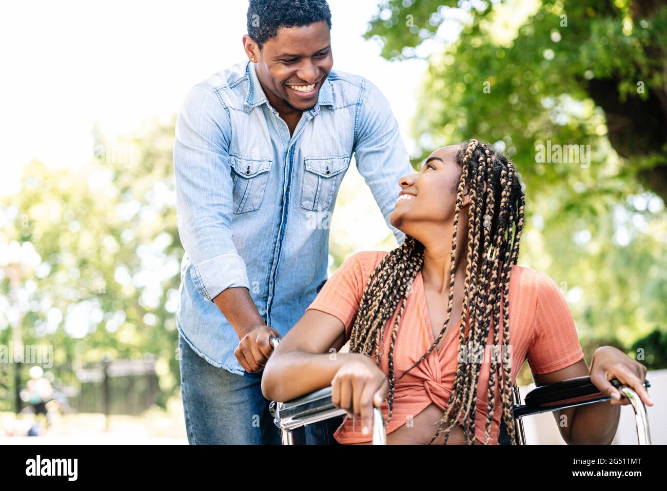 Woman in a wheelchair enjoying a walk with her boyfriend Stock Photo ...