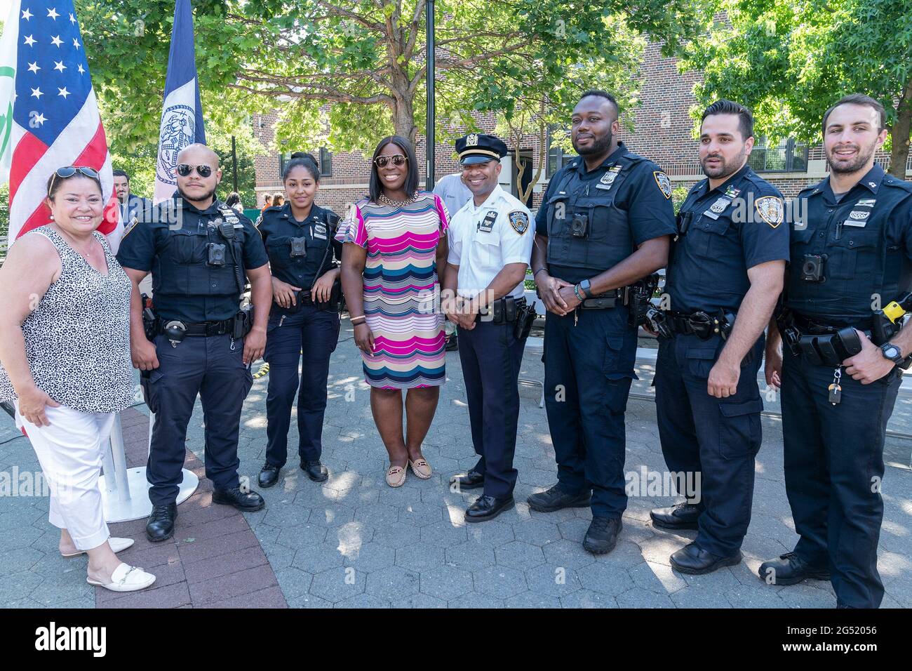 New York, United States. 24th June, 2021. Police officers from 44th precinct  and Bronx Parks Commissioner Iris Rodriguez-Rosa (L) and City Council  Member Vanessa Gibson (4th from left) attended NYC Parks, Garden