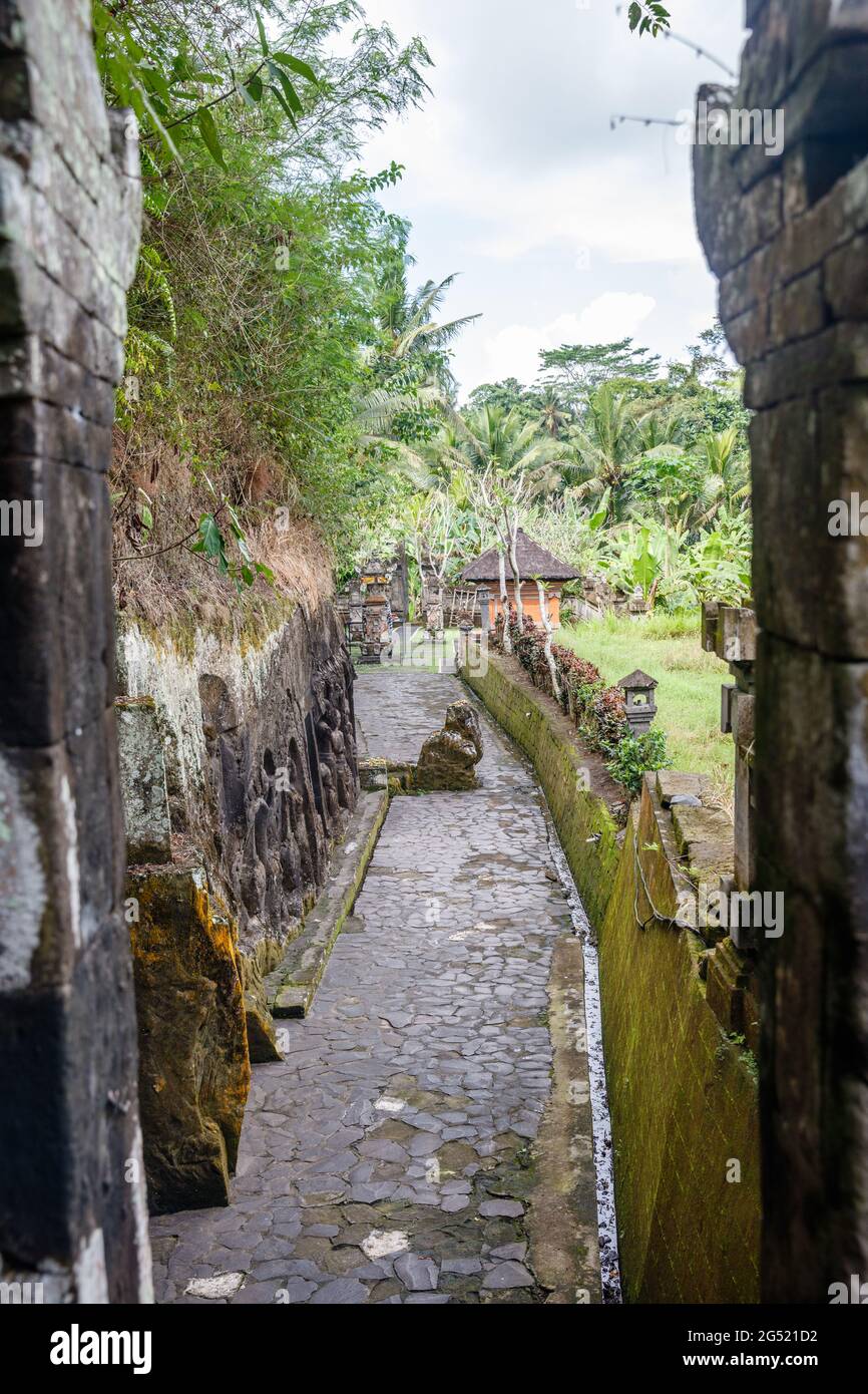 Yeh Pulu - Ancient relief in Desa Bedulu, Kabupaten Gianyar, Bali, Indonesia. Carving in the rock wall. Stock Photo