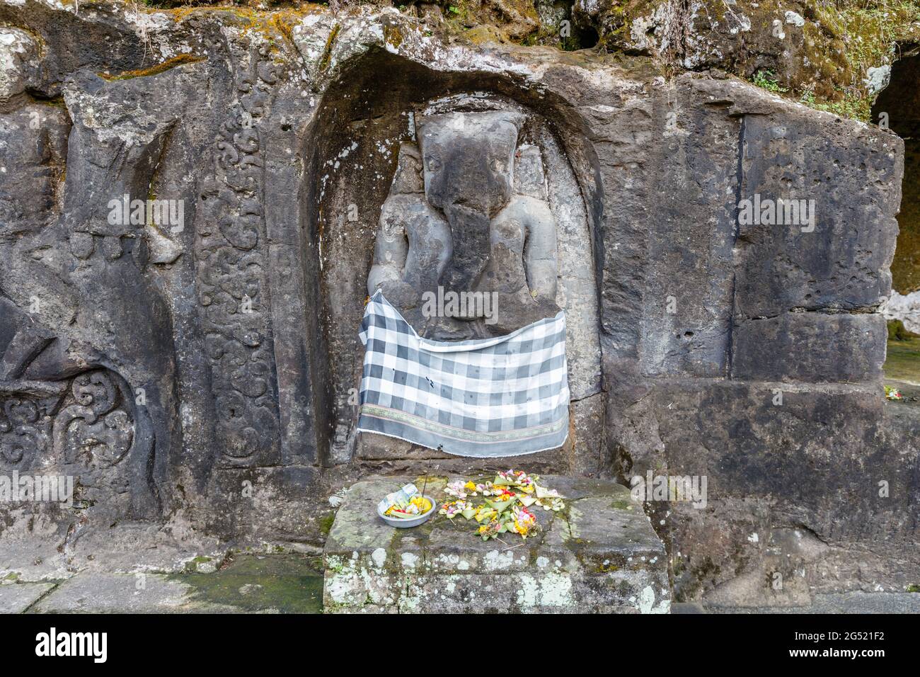 Yeh Pulu - Ancient relief in Desa Bedulu, Kabupaten Gianyar, Bali, Indonesia. Carving in the rock wall. Stock Photo