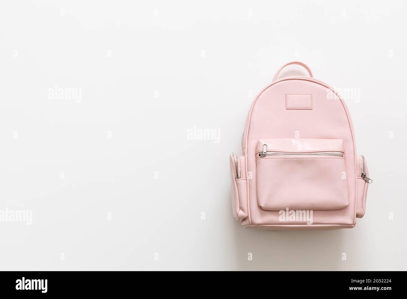 Elegant leather pink female backpack isolated on white with copy space.  Back to school concept Stock Photo - Alamy