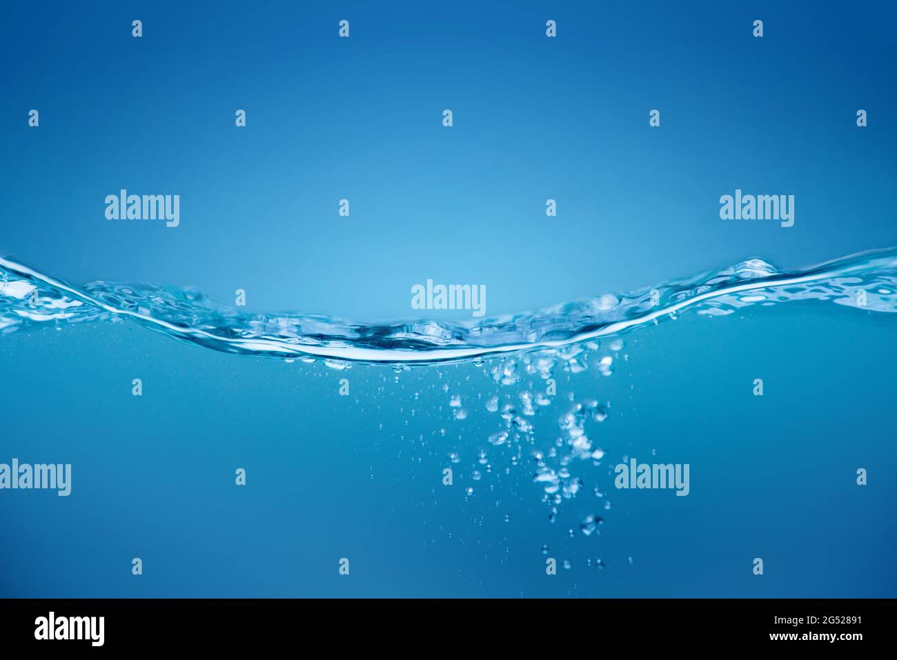 Water waves ,Splashed water wave in clean blue water. Stock Photo