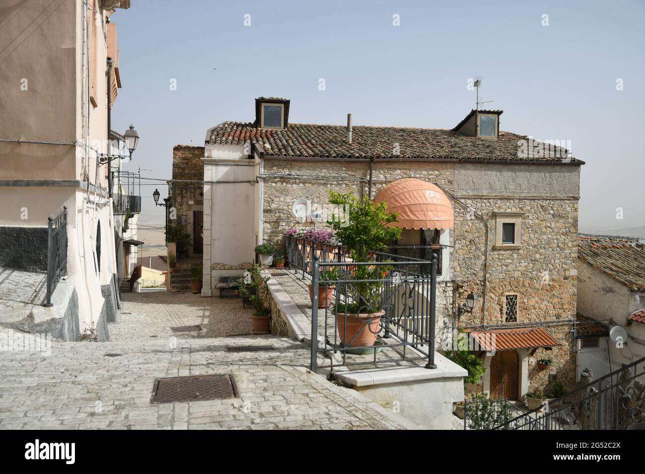 Candela, Italy, June 23, 2021. A small street between the old houses of a  mediterranean village of Puglia region Stock Photo - Alamy