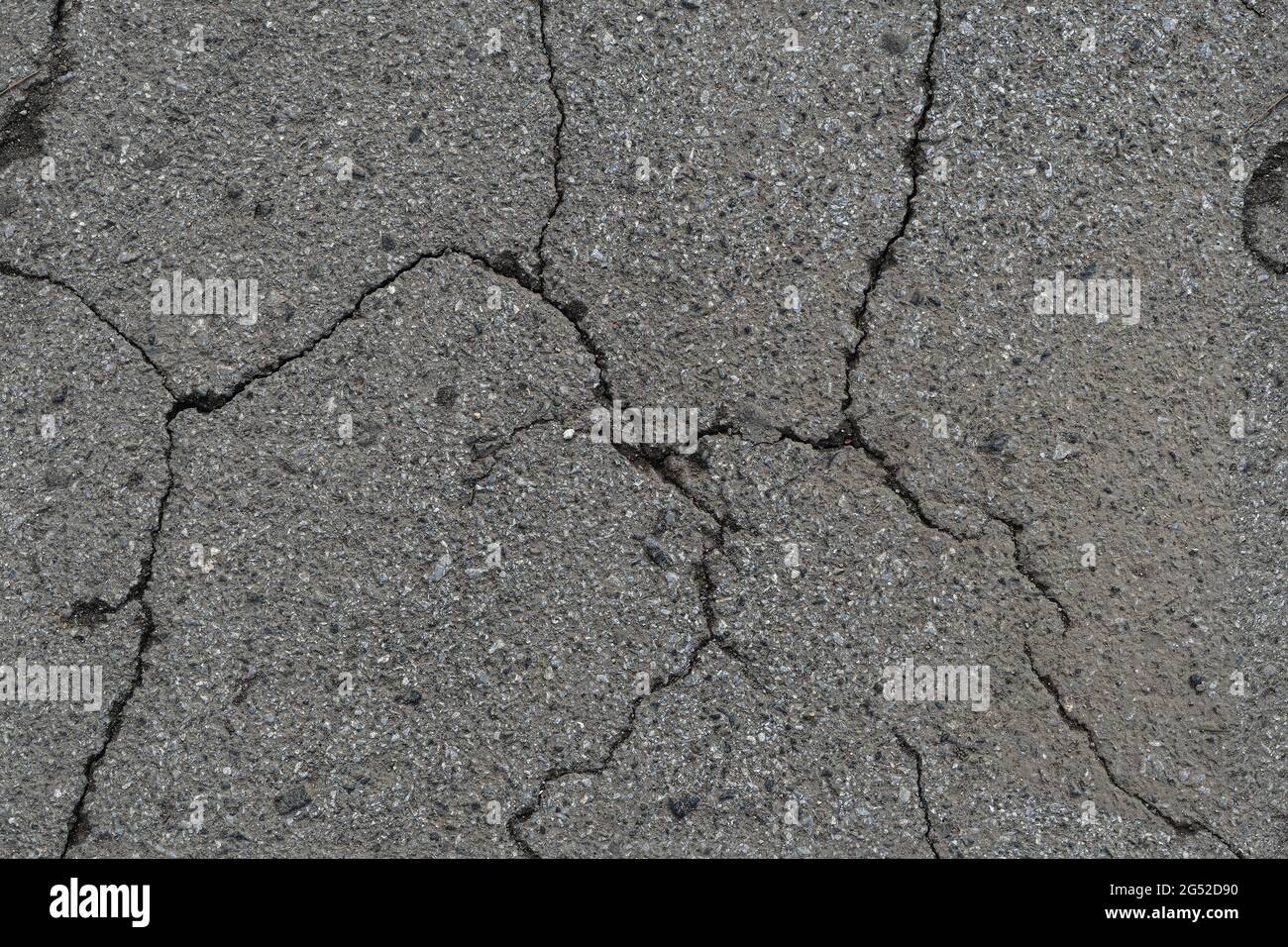 Seamless cracked gray road asphalt texture Stock Photo