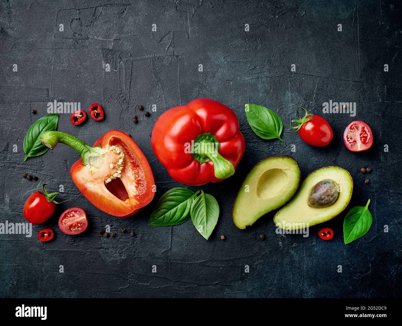 various fresh raw vegetables composition on black painted background, top view Stock Photo