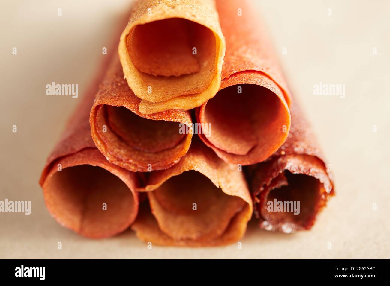 Close up of sweet pure fruit pastille in rolls and healthy sweets