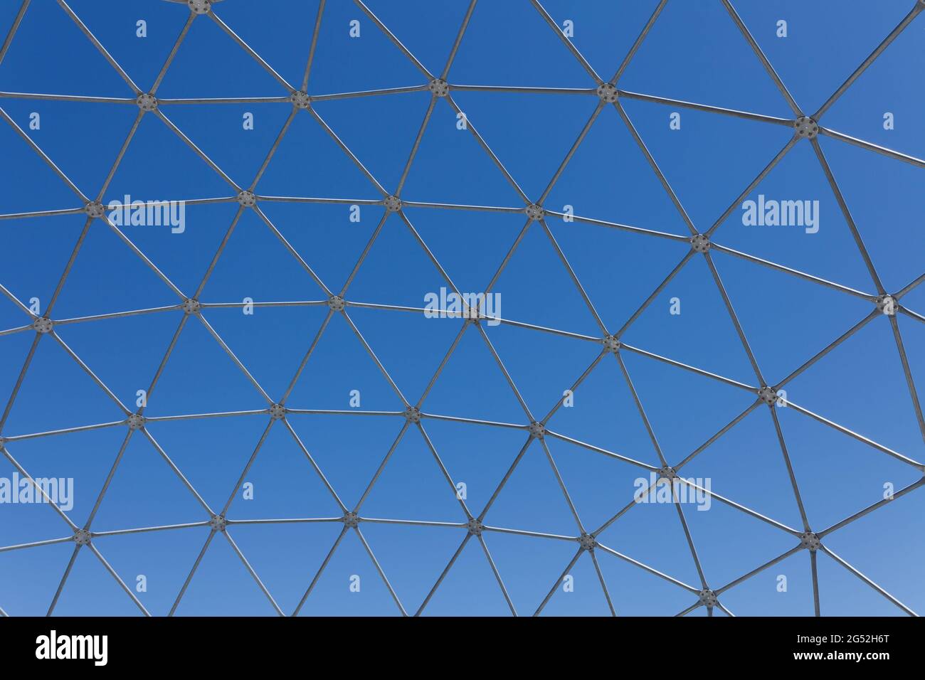 Steel polygon frame shell structure against blue sky Stock Photo - Alamy
