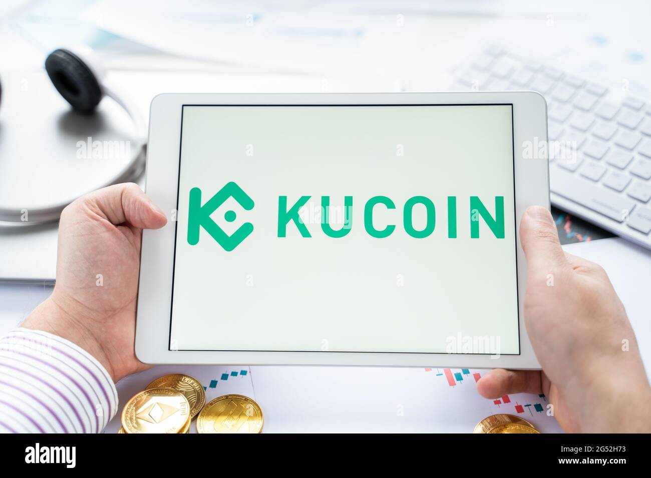 Russia Moscow 05.05.2021. Tablet with logo of cryptocurrency stock exchange  Kucoin, China. Crypto coins company, service for buying, selling, trading  Stock Photo - Alamy