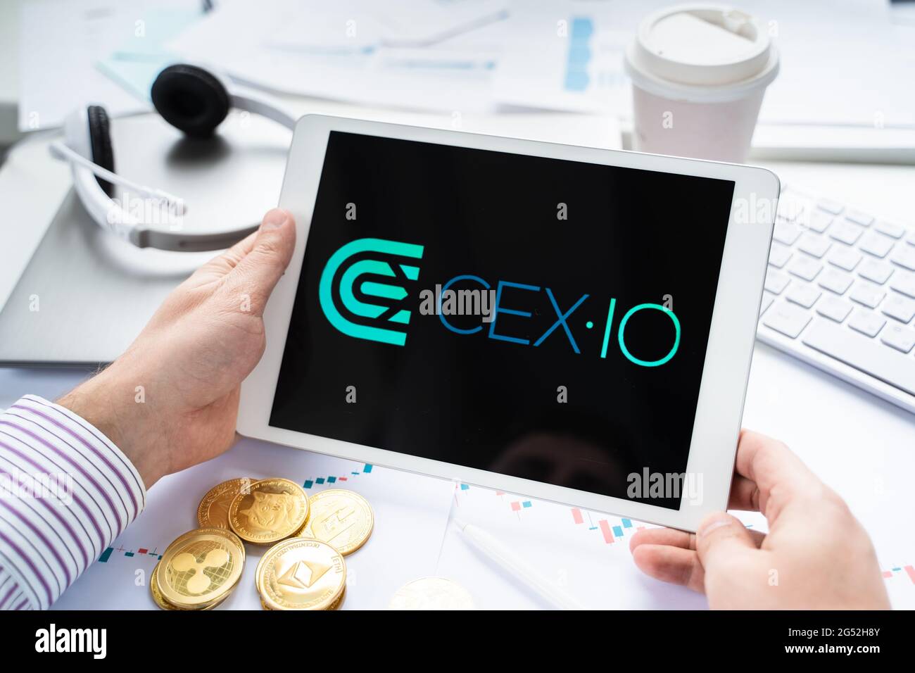 Russia Moscow 05.05.2021.Businessman holding tablet with logo of  cryptocurrency stock exchange Cex.io. Buy,sell,change crypto coins,diital  money BTC,B Stock Photo - Alamy
