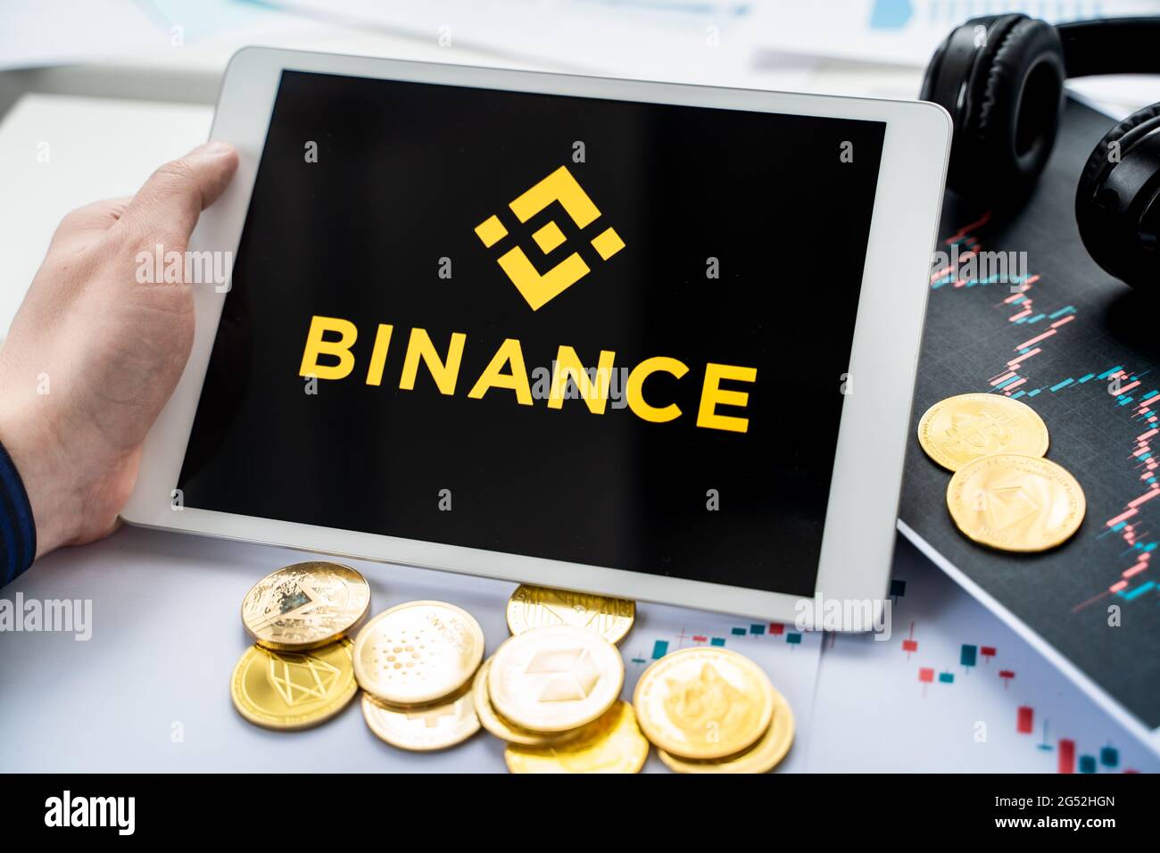 Russia Moscow 05.05.2021.Businessman holding tablet with logo of  cryptocurrency stock exchange Binance. Buy,sell,change crypto coins,diital  money BTC Stock Photo - Alamy