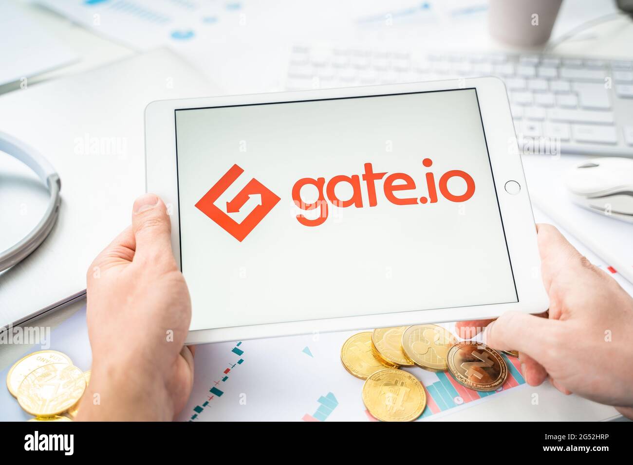 Russia Moscow 06.05.2021.Businessman with tablet.Logo of cryptocurrency  stock exchange Gate.io.Trading blockchain platform to buy,sell digital  crypto Stock Photo - Alamy