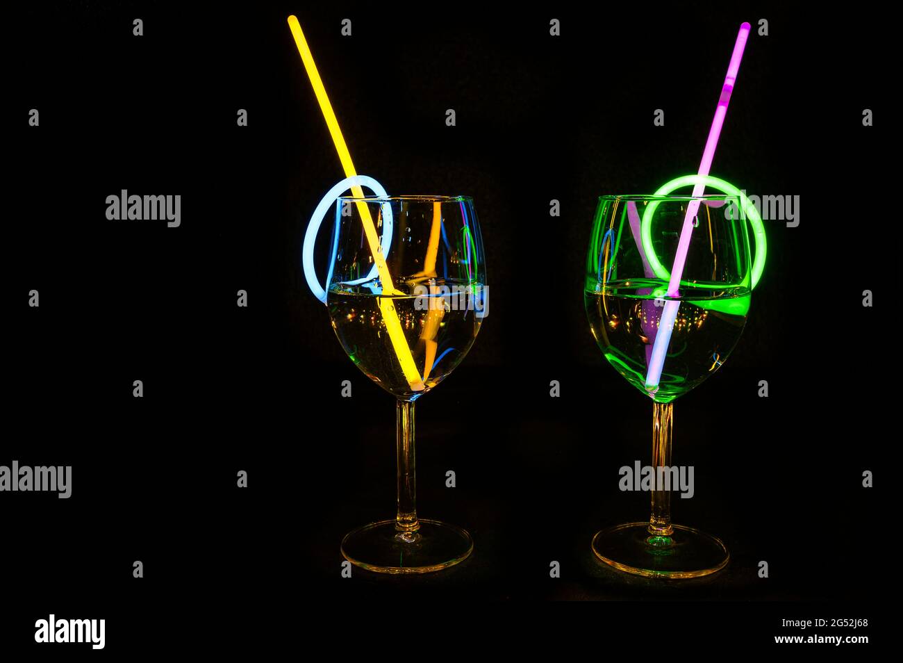 Holiday party delicious drink in a bar wine glass colorful light reflection with dark background for holidays, christmas, new year and gathering leisu Stock Photo