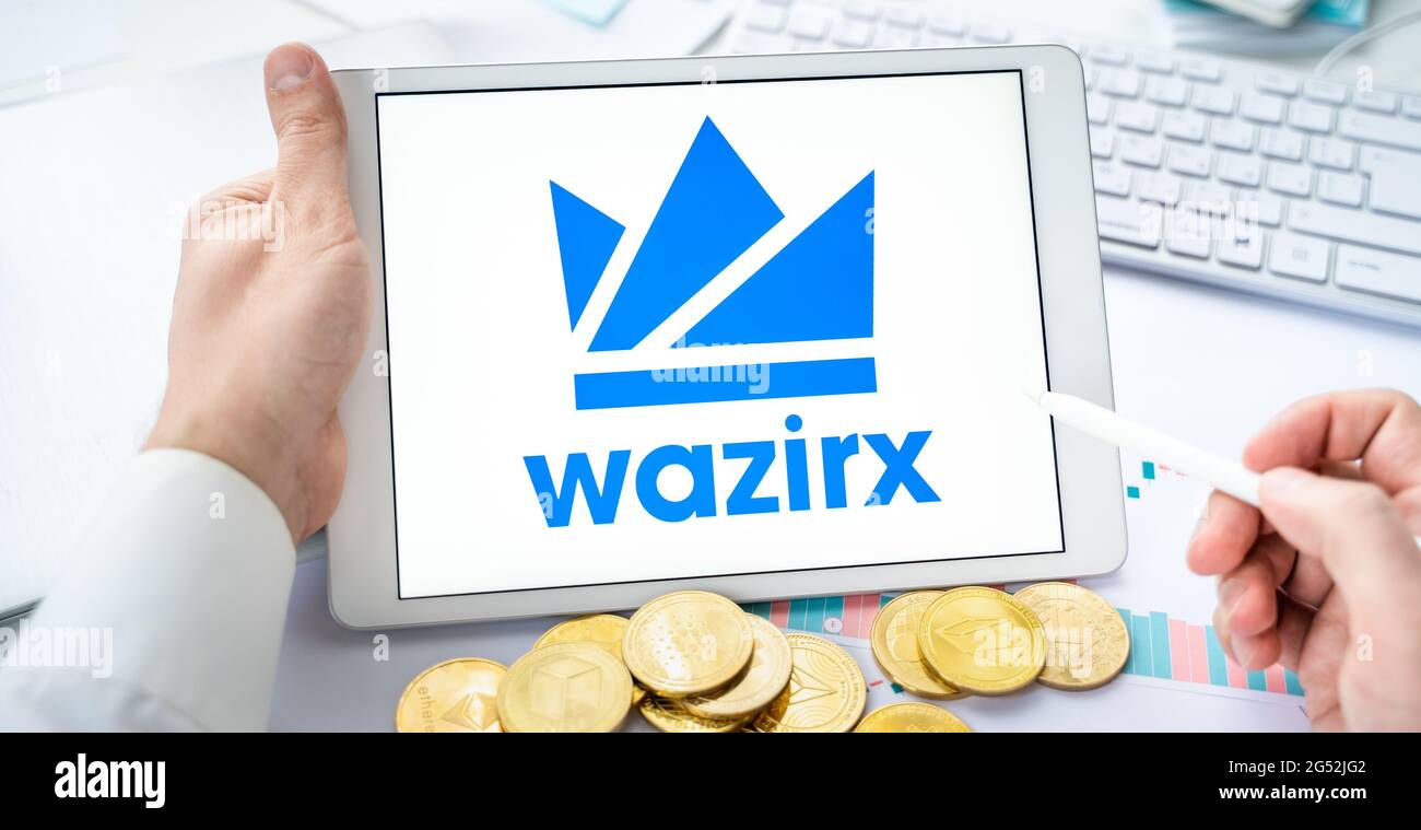 Russia Moscow 06.05.2021.Businessman with tablet.Logo of cryptocurrency  stock exchange Wazirx.Trading blockchain platform to buy,sell digital crypto  c Stock Photo - Alamy