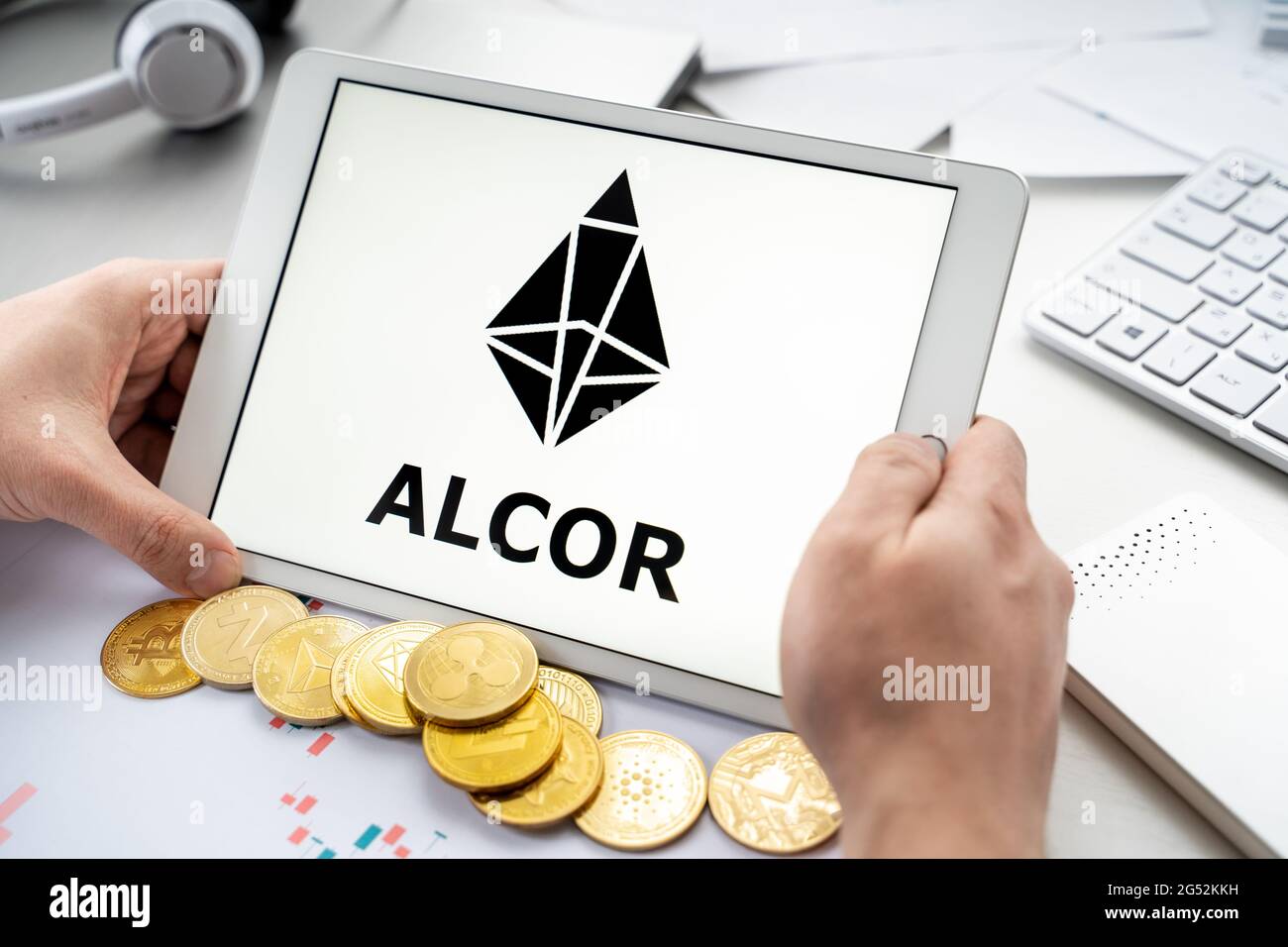 Russia Moscow 06.05.2021.Businessman with tablet.Logo of cryptocurrency  stock exchange Alcor.Trading blockchain platform to buy,sell digital crypto  co Stock Photo - Alamy
