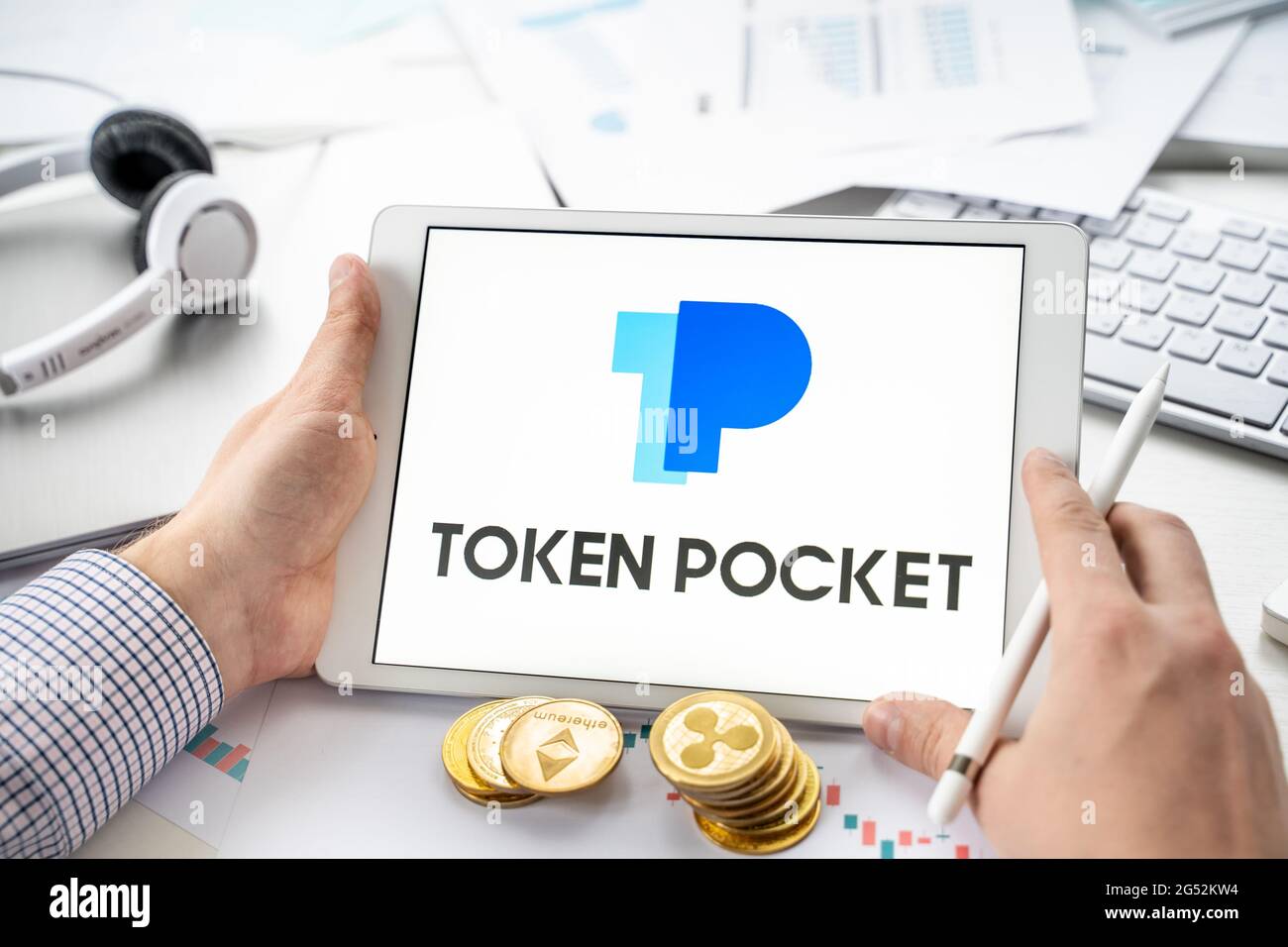 Russia Moscow 06.05.2021 Businessman, tablet. Logo of software cryptocurrency  wallet,gateway Token Pocket. Blockchain application to buy,store,send,sw  Stock Photo - Alamy