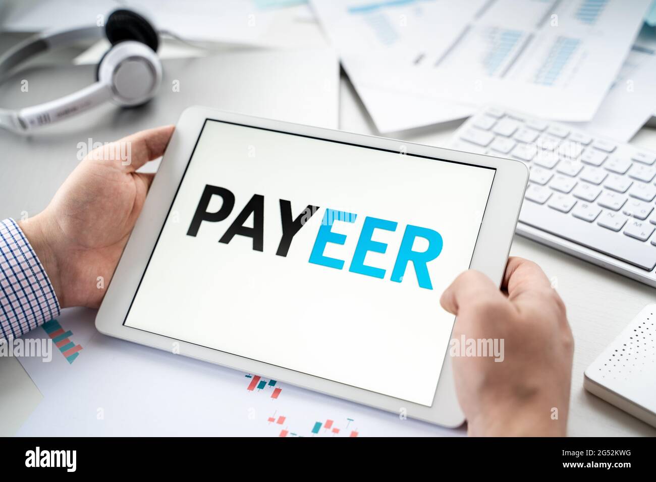 Russia Moscow 06.05.2021.Tablet with logo of Payeer,payment  service,system,platform for cryptocurrency.Wallet for using blockchain  platforms to swap,b Stock Photo - Alamy